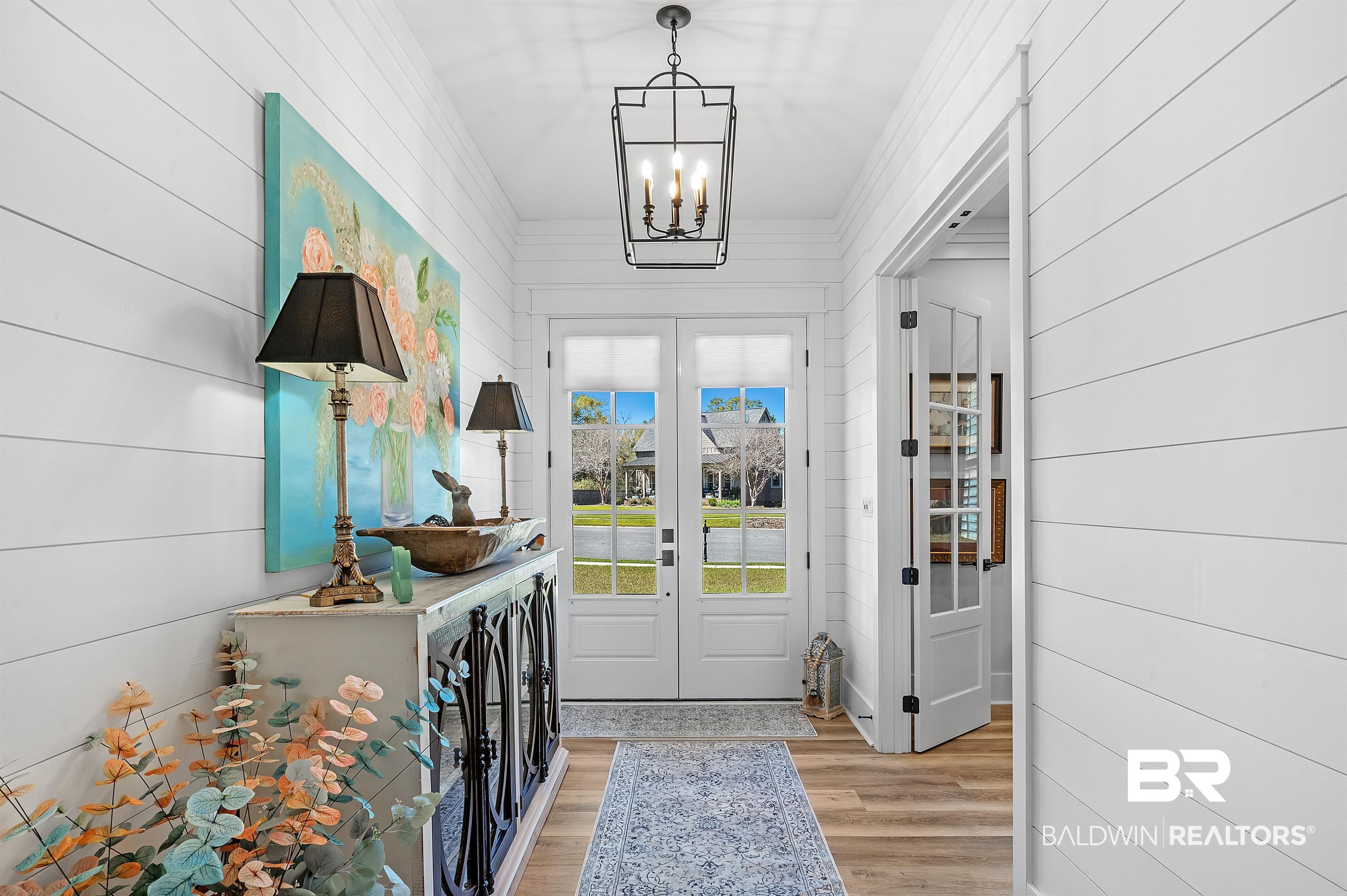 9144 Harvest Ridge Fairhope, AL 36532 - Photo 16 of 58 Foyer with french doors, light wood finished floors, and a chandelier