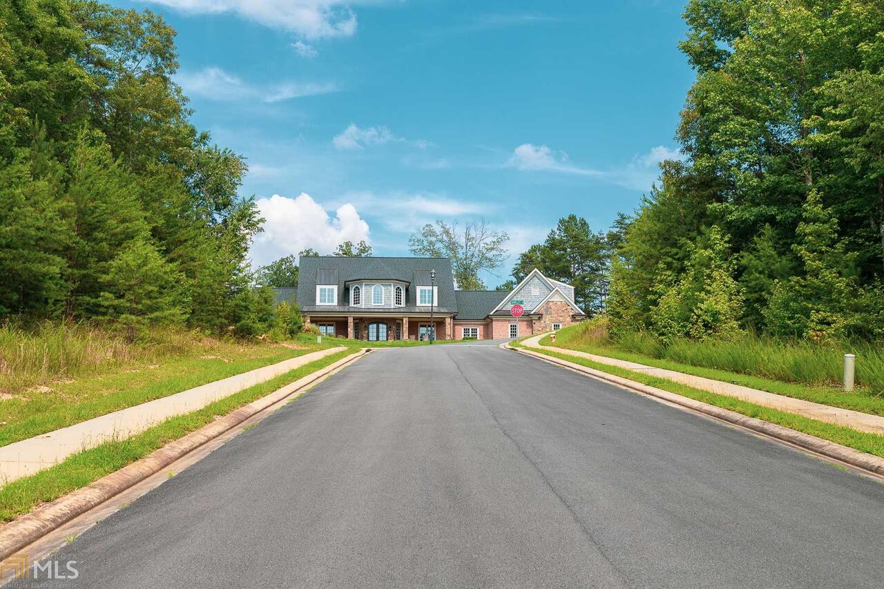 15 Jewell Drive Southeast, Unit 3 Rome, GA 30161 - Photo 23 of 26 a view of a lake with a big yard