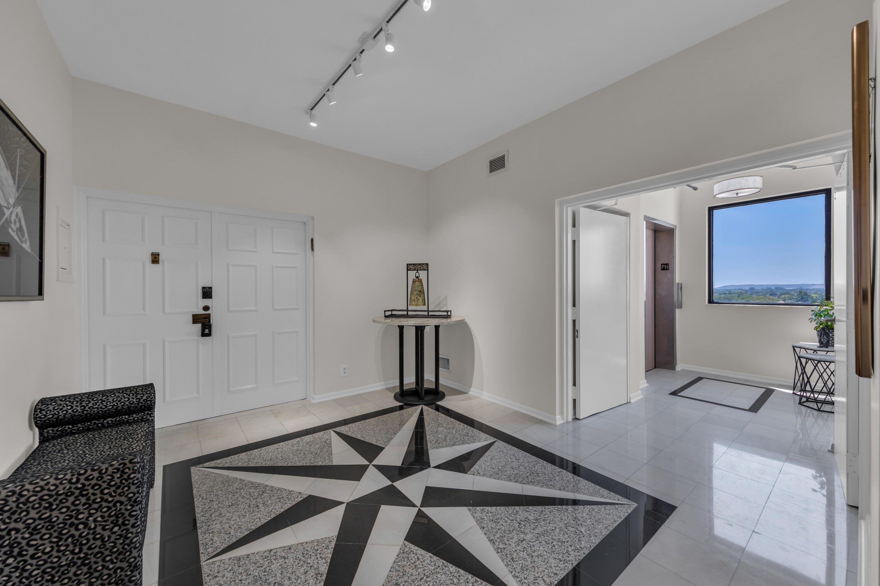 7351 Promenade Drive, Unit 801F Boca Raton, FL 33433 - Photo 39 of 47 Semi private elevator landing