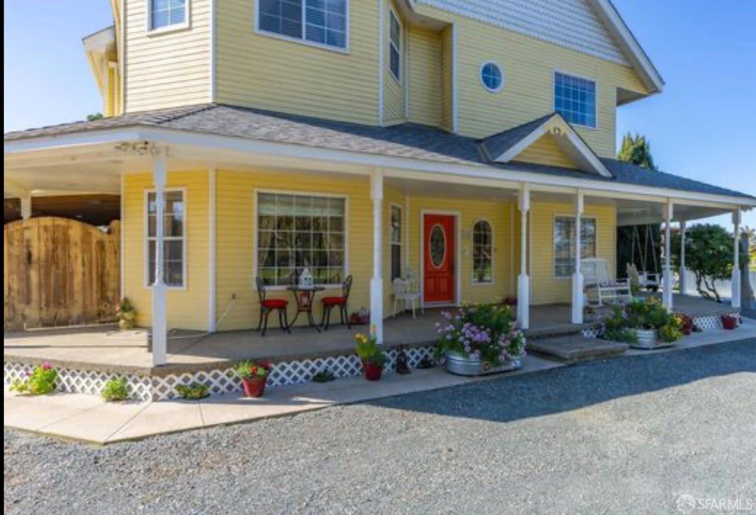 4100 Gateway Road Bethel Island, CA 94511 - Photo 11 of 53 front view of a brick house with potted plants