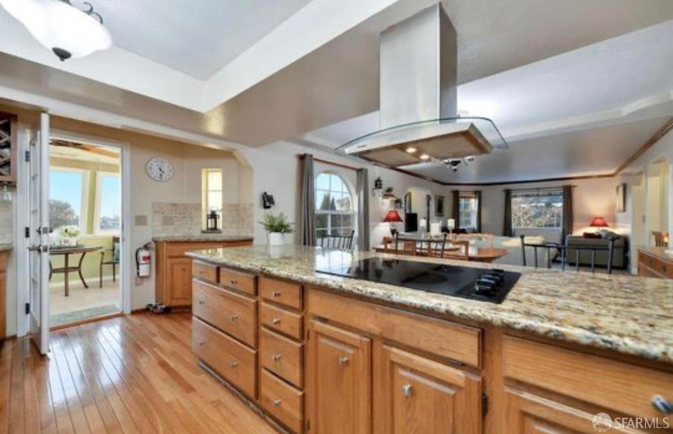 4100 Gateway Road Bethel Island, CA 94511 - Photo 13 of 53 a large kitchen with stainless steel appliances granite countertop a lot of counter space and wooden floors