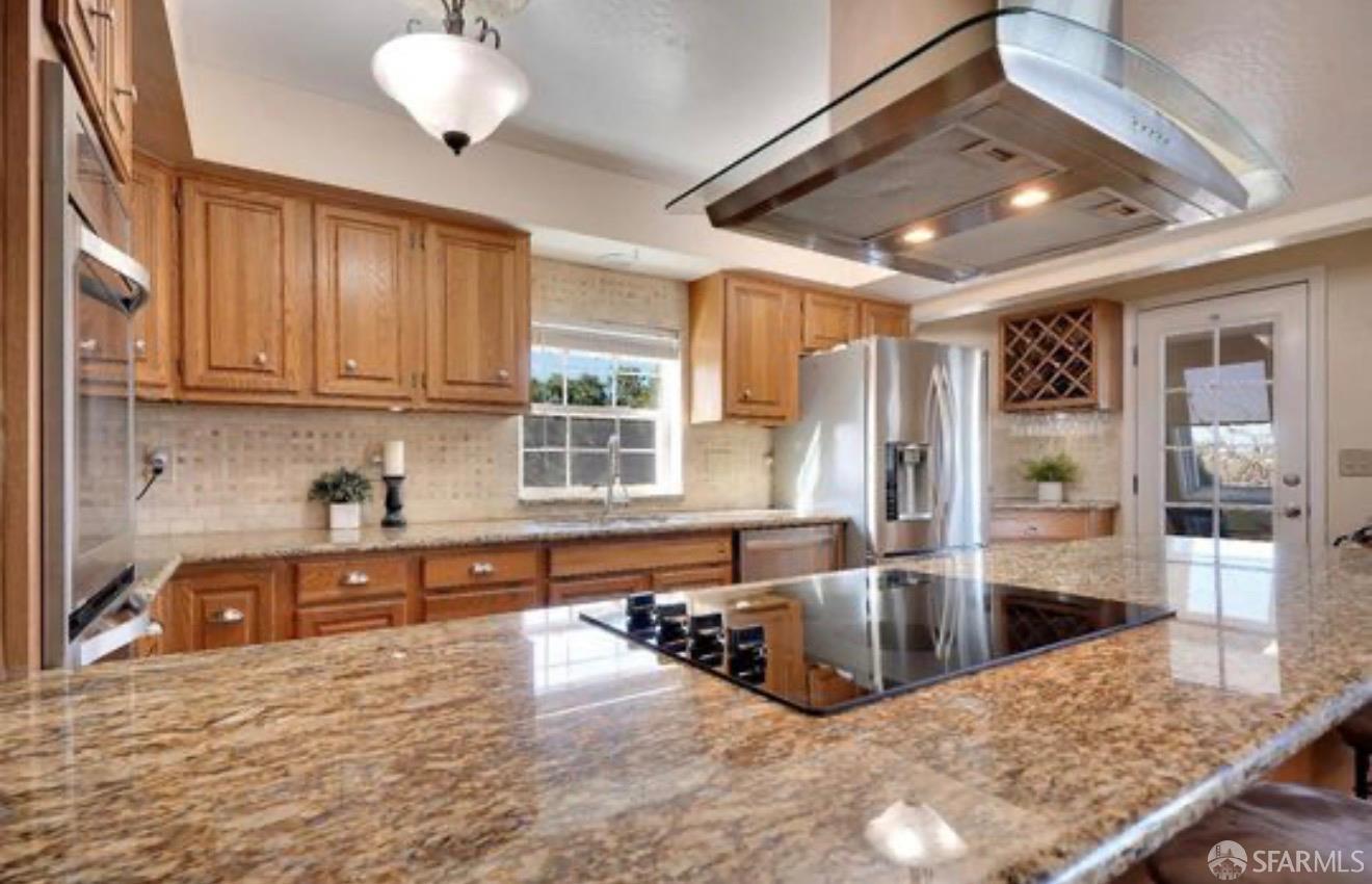 4100 Gateway Road Bethel Island, CA 94511 - Photo 18 of 53 a kitchen with stainless steel appliances granite countertop a stove and cabinets