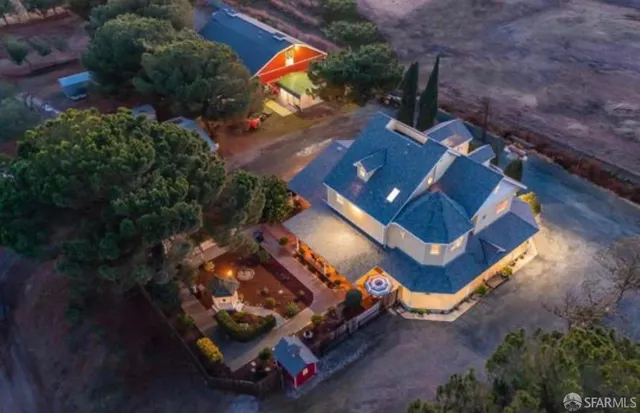 an aerial view of a house with a garden