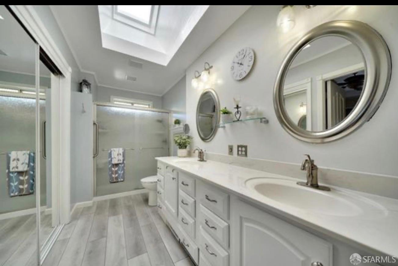 4100 Gateway Road Bethel Island, CA 94511 - Photo 25 of 53 a spacious bathroom with a double vanity sink and a mirror
