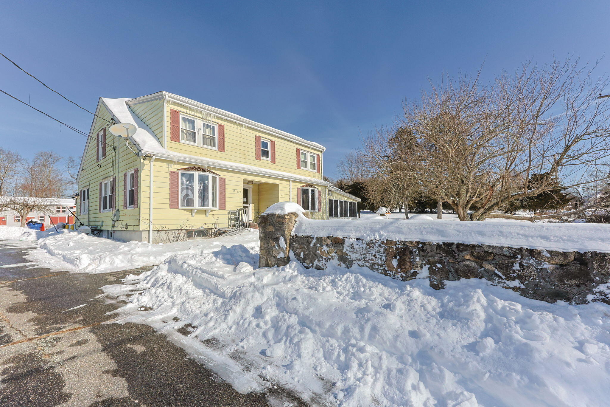 320-322 Old Bedford Road Westport, MA 02790 - Photo 2 of 33 a front view of a house with a yard