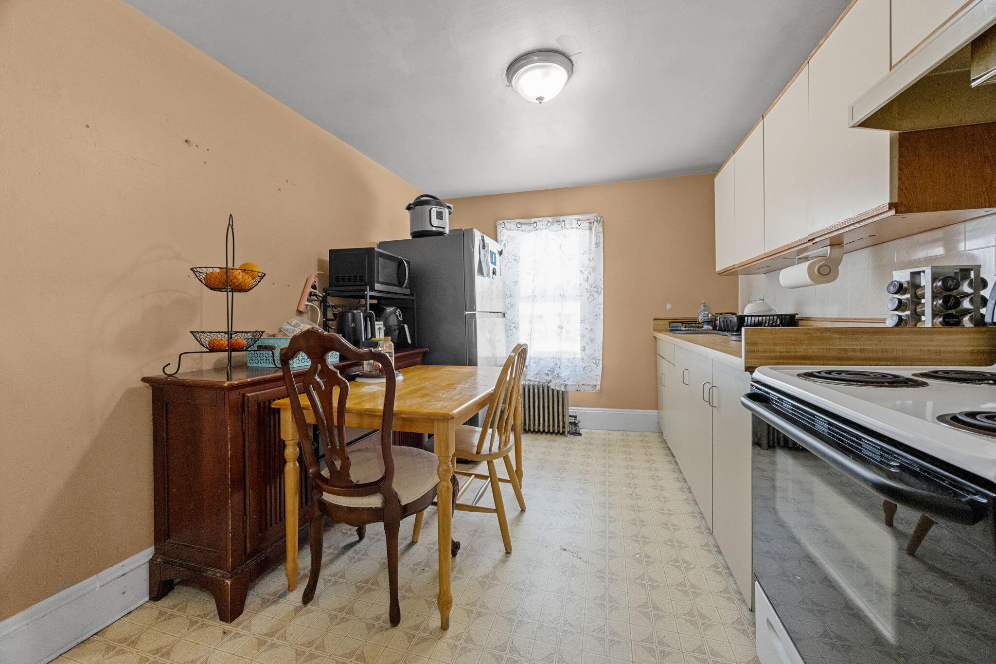 320-322 Old Bedford Road Westport, MA 02790 - Photo 6 of 33 a kitchen with a sink cabinets and stainless steel appliances