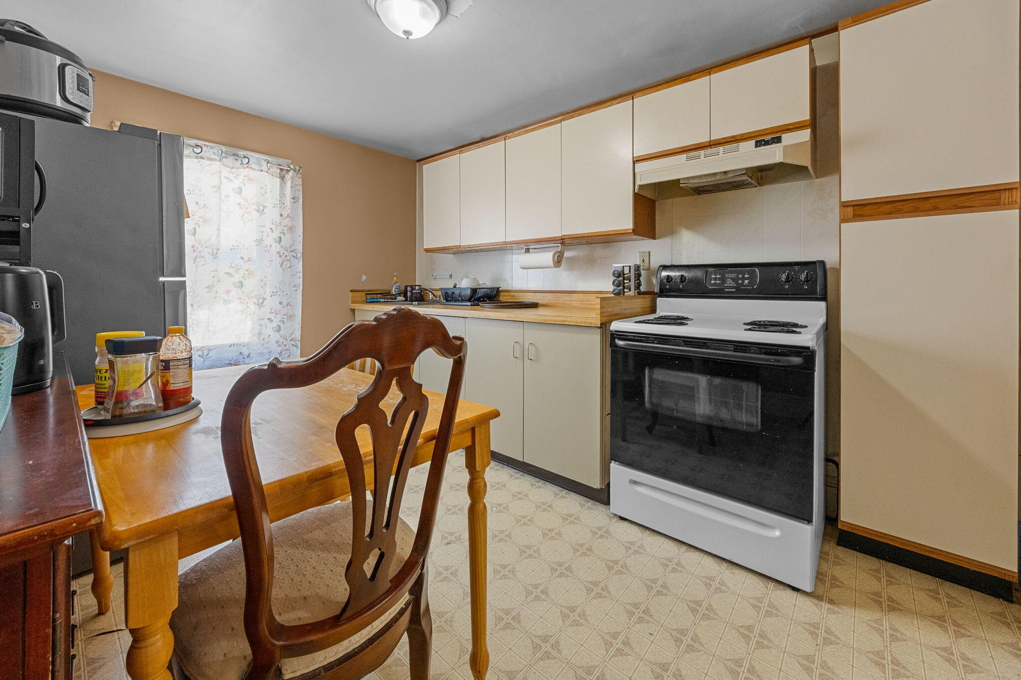 320-322 Old Bedford Road Westport, MA 02790 - Photo 7 of 33 a kitchen with stainless steel appliances granite countertop a stove a sink dishwasher and a refrigerator