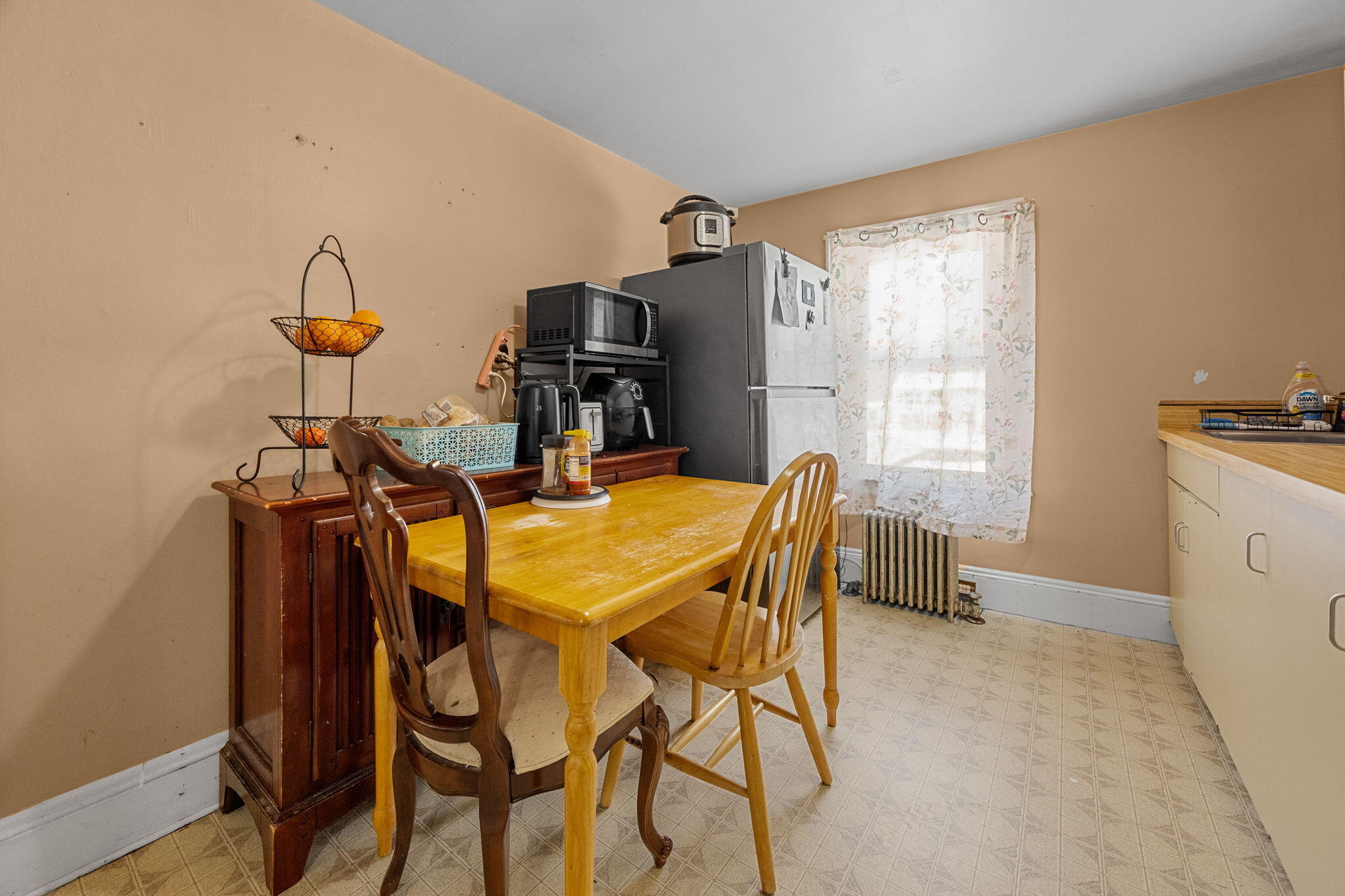 320-322 Old Bedford Road Westport, MA 02790 - Photo 8 of 33 a view of a dining room with furniture and a window