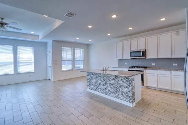 a view of a large pool with an outdoor space