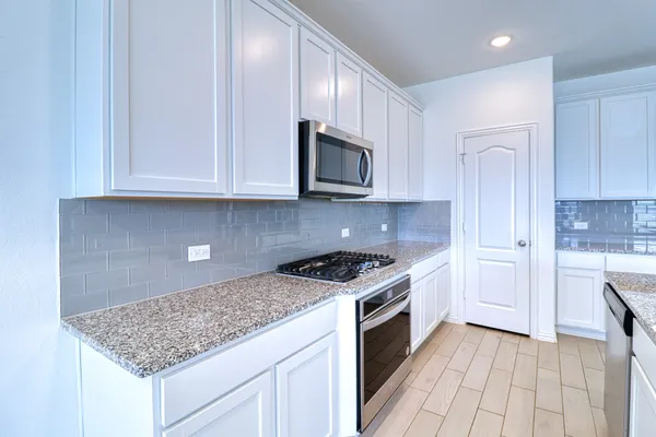 a view of walk in closet with empty room