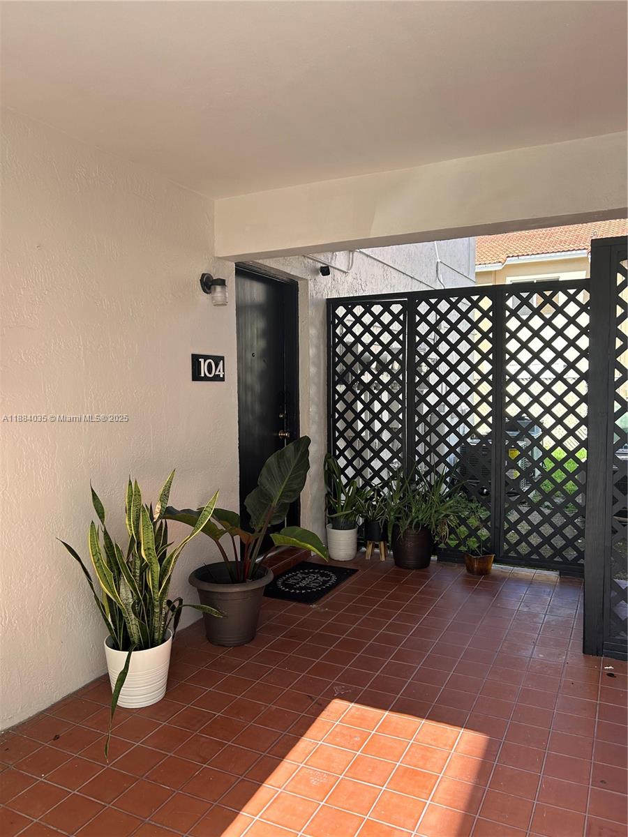 13045 Southwest 68th Street, Unit 104 Miami, FL 33183 - Photo 14 of 16 a view of a terrace with chair