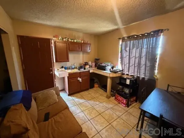 a kitchen with a sink cabinets and appliances