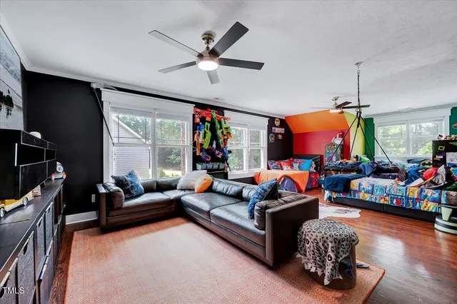 a bed room with furniture and natural light
