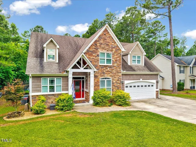 front view of a house with a yard