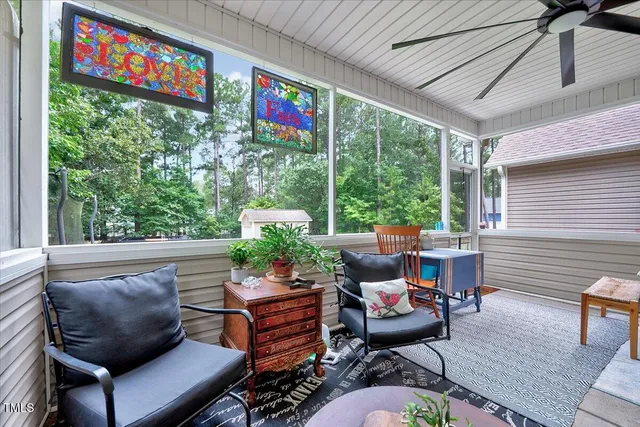 a front view of a house with a garden and yard