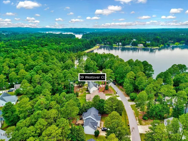 a view of an swimming pool with a yard