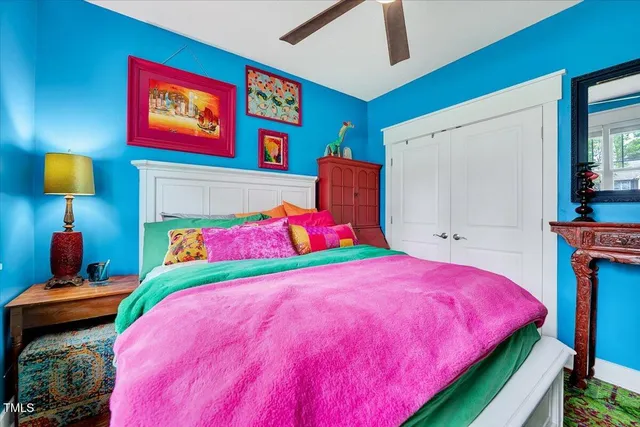 a bedroom with a bed and a lamp