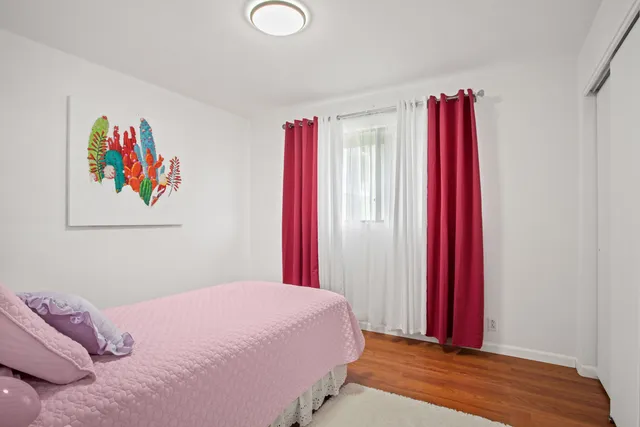 a bedroom with a bed and a large closet