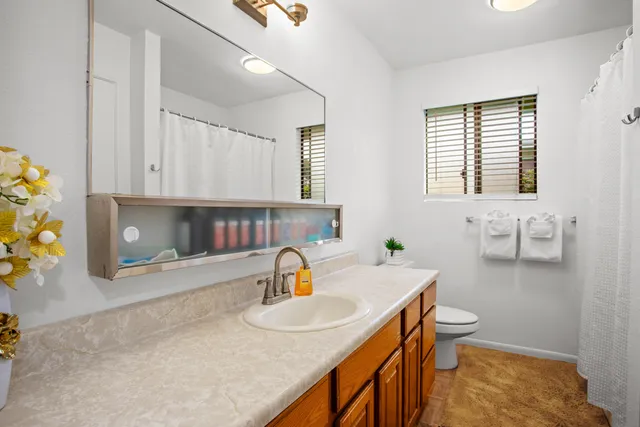 a kitchen with a sink and a stove top oven