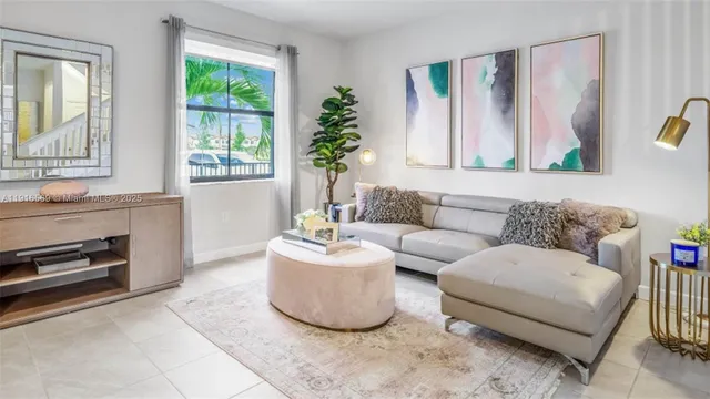 a living room with furniture and a window