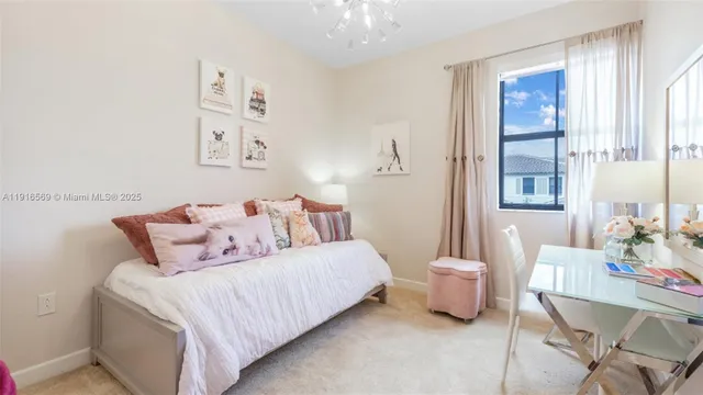 a bedroom with a bed and a table