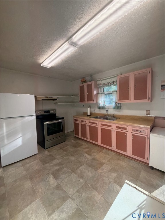 1313 Poplar Lawn Road Blackstone, VA 23824 - Photo 11 of 26 a kitchen with stainless steel appliances a stove a sink and a microwave