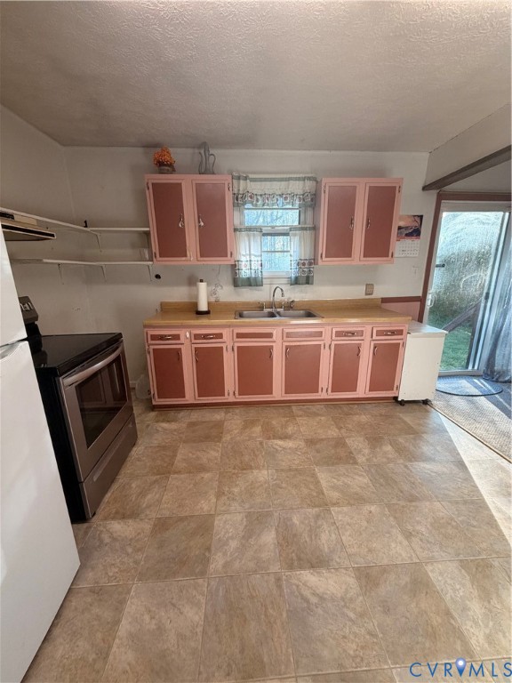 1313 Poplar Lawn Road Blackstone, VA 23824 - Photo 12 of 26 a large kitchen with granite countertop a stove a sink dishwasher and a oven