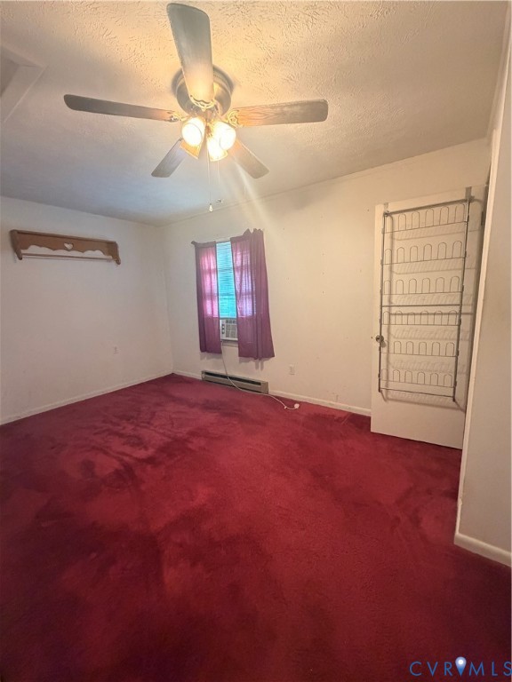 1313 Poplar Lawn Road Blackstone, VA 23824 - Photo 14 of 26 an empty room with windows and fan