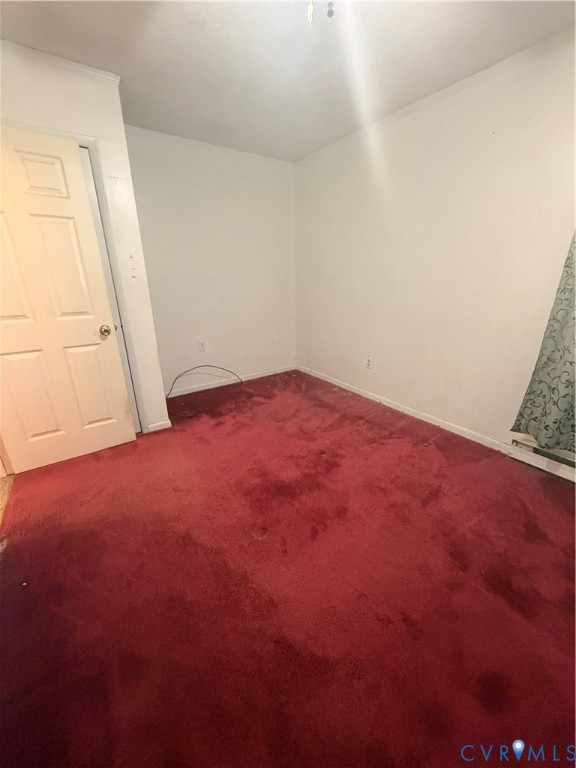 1313 Poplar Lawn Road Blackstone, VA 23824 - Photo 18 of 26 an empty room with a window