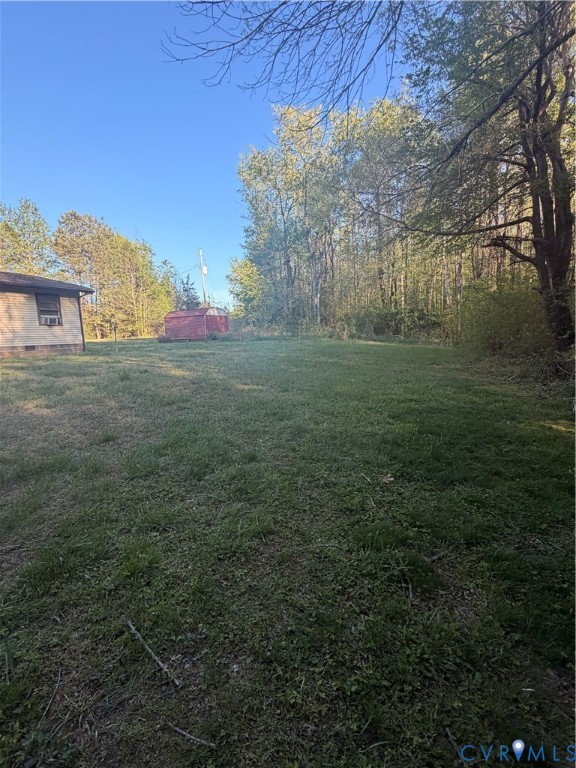 1313 Poplar Lawn Road Blackstone, VA 23824 - Photo 23 of 26 a view of a big yard with a house