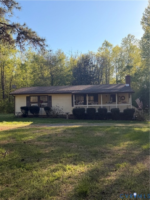 1313 Poplar Lawn Road Blackstone, VA 23824 - Photo 3 of 26 a front view of a house with a garden