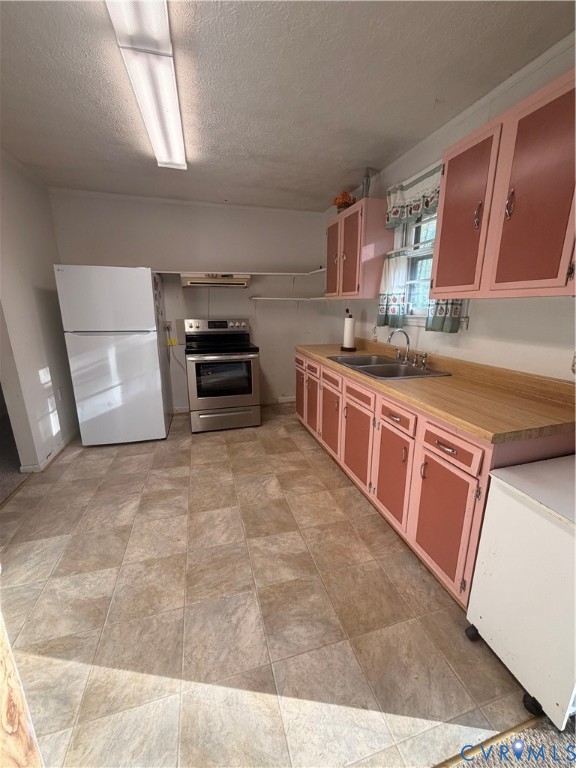 1313 Poplar Lawn Road Blackstone, VA 23824 - Photo 10 of 26 a kitchen with stainless steel appliances a stove a sink and a microwave