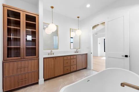 a kitchen with white cabinets