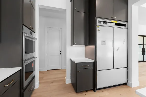 a kitchen with stainless steel appliances granite countertop a stove and a refrigerator