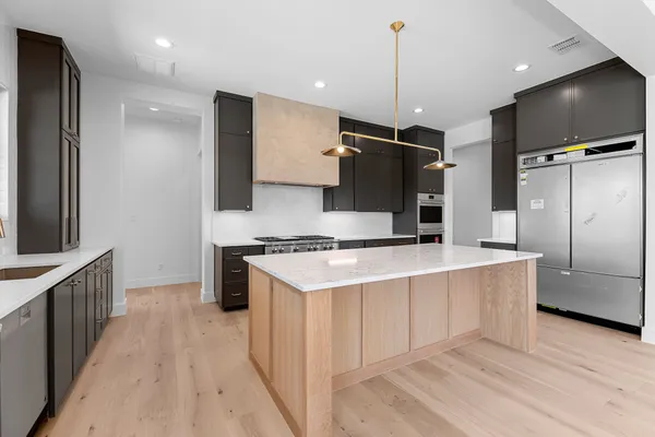 a view of walk in closet with empty racks