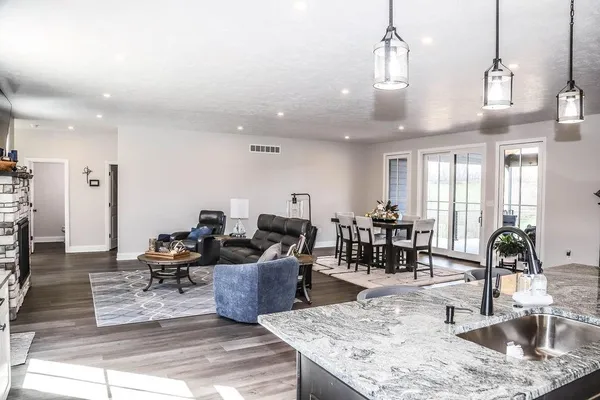 a workspace with wooden floor and white cabinet
