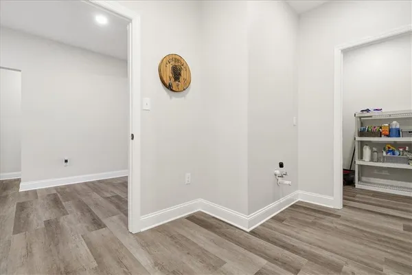 a view of a patio with table and chairs and barbeque