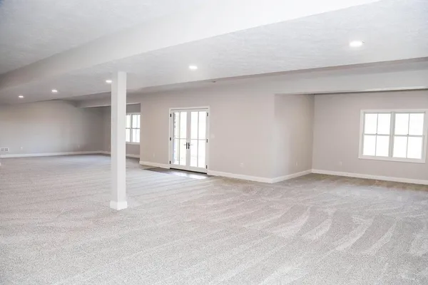 a view of a swimming pool and lounge chairs