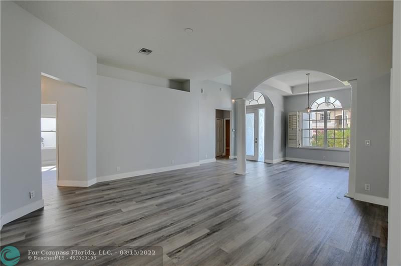 Boca Falls Boca Raton, FL 33428 - Photo 12 of 40 a view of an empty room with wooden floor and a window