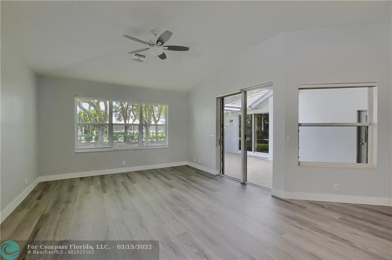 Boca Falls Boca Raton, FL 33428 - Photo 14 of 40 wooden floor in an empty room with a window