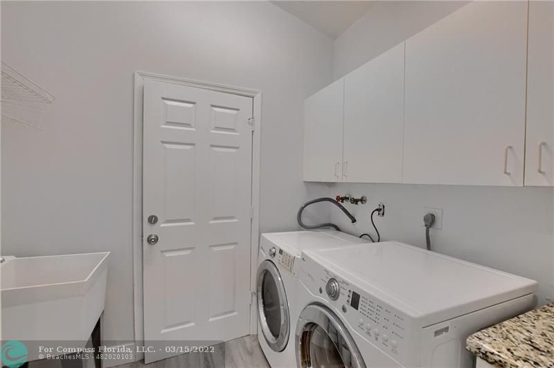 Boca Falls Boca Raton, FL 33428 - Photo 21 of 40 a utility room with dryer and washer