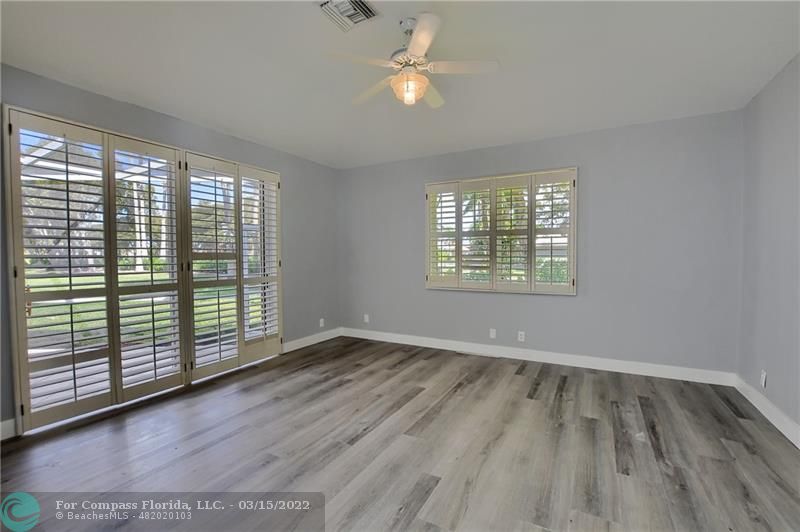 Boca Falls Boca Raton, FL 33428 - Photo 26 of 40 wooden floor in an empty room with a window