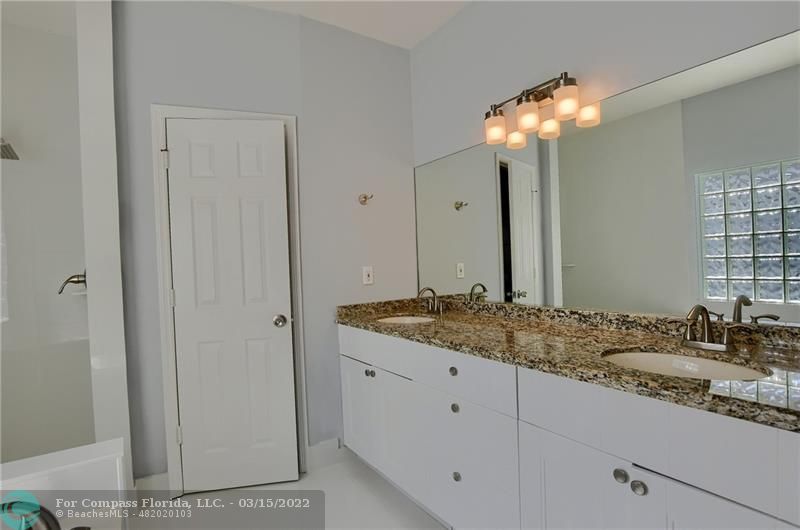 Boca Falls Boca Raton, FL 33428 - Photo 28 of 40 a bathroom with a sink and a mirror