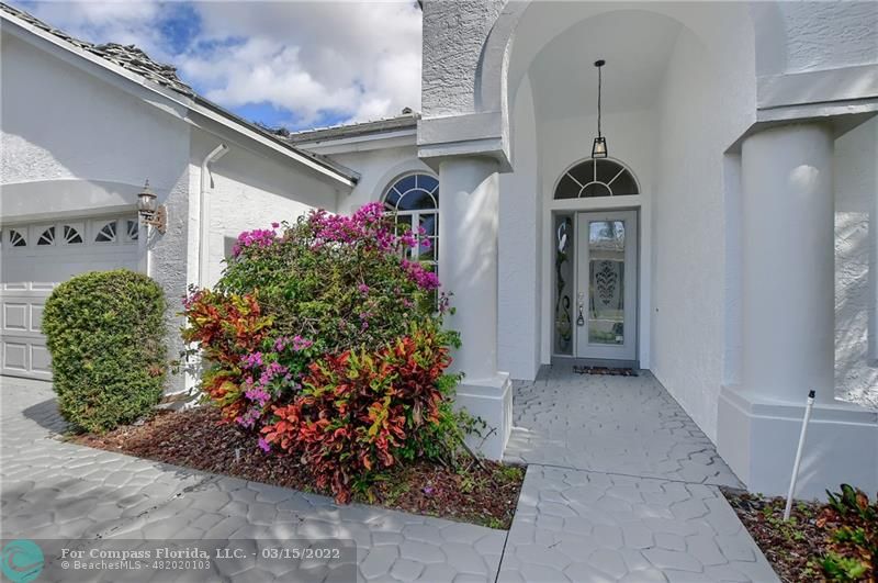 Boca Falls Boca Raton, FL 33428 - Photo 3 of 40 a front view of a house