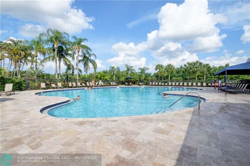 Boca Falls Boca Raton, FL 33428 - Photo 32 of 40 a view of swimming pool with a yard and lake view in the back