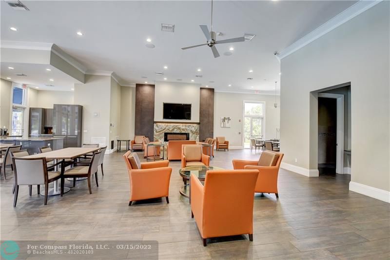 Boca Falls Boca Raton, FL 33428 - Photo 37 of 40 a living room with fireplace furniture and a flat screen tv