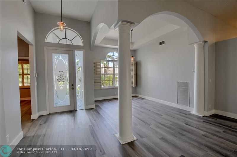 Boca Falls Boca Raton, FL 33428 - Photo 5 of 40 wooden floor in an empty room with a window