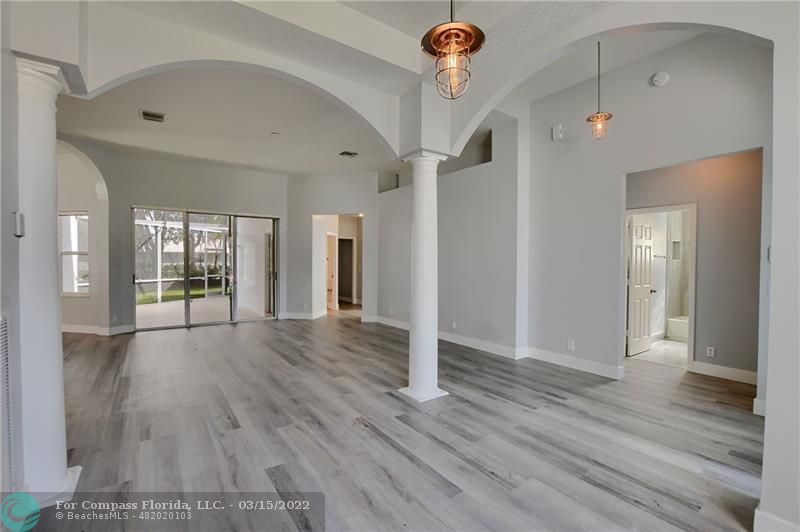 Boca Falls Boca Raton, FL 33428 - Photo 7 of 40 a view of a hallway view with wooden floor and staircase