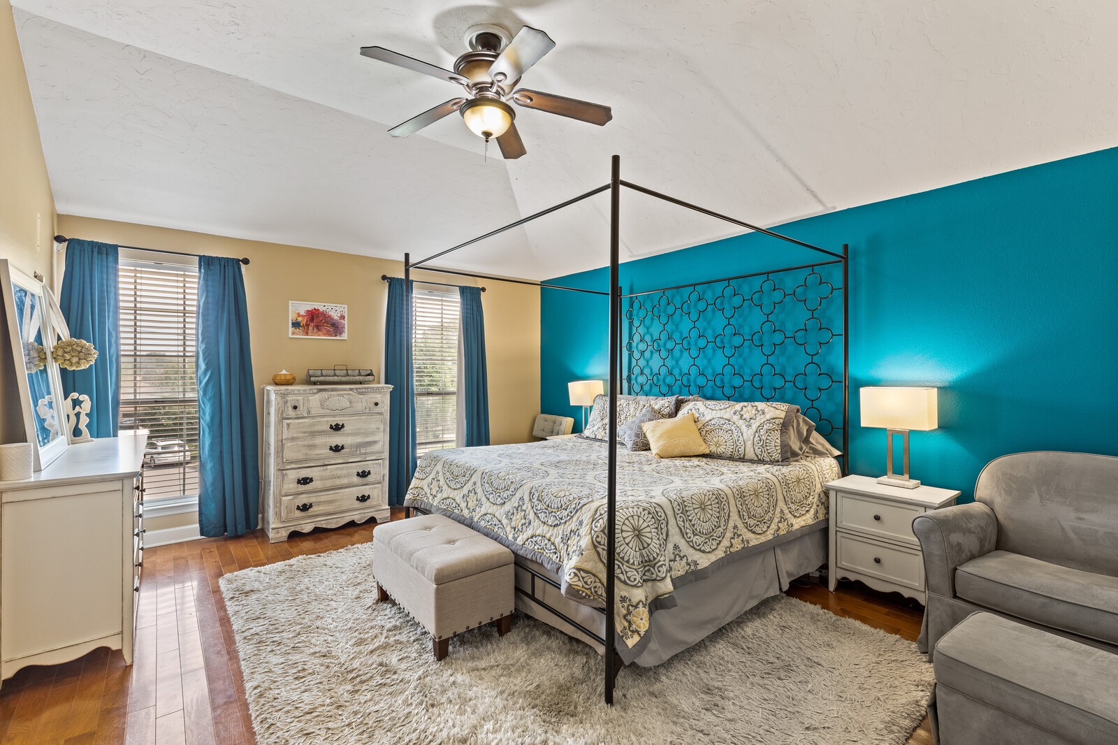 1225 Jacksons View Road Hermitage, TN 37076 - Photo 13 of 29 a bedroom with a bed a chandelier and a couch