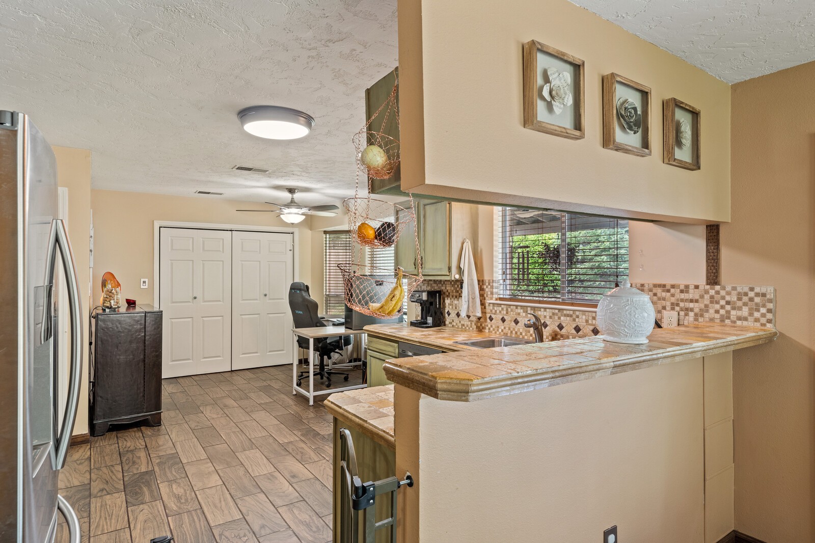 1225 Jacksons View Road Hermitage, TN 37076 - Photo 9 of 29 a room with a table chairs and a refrigerator